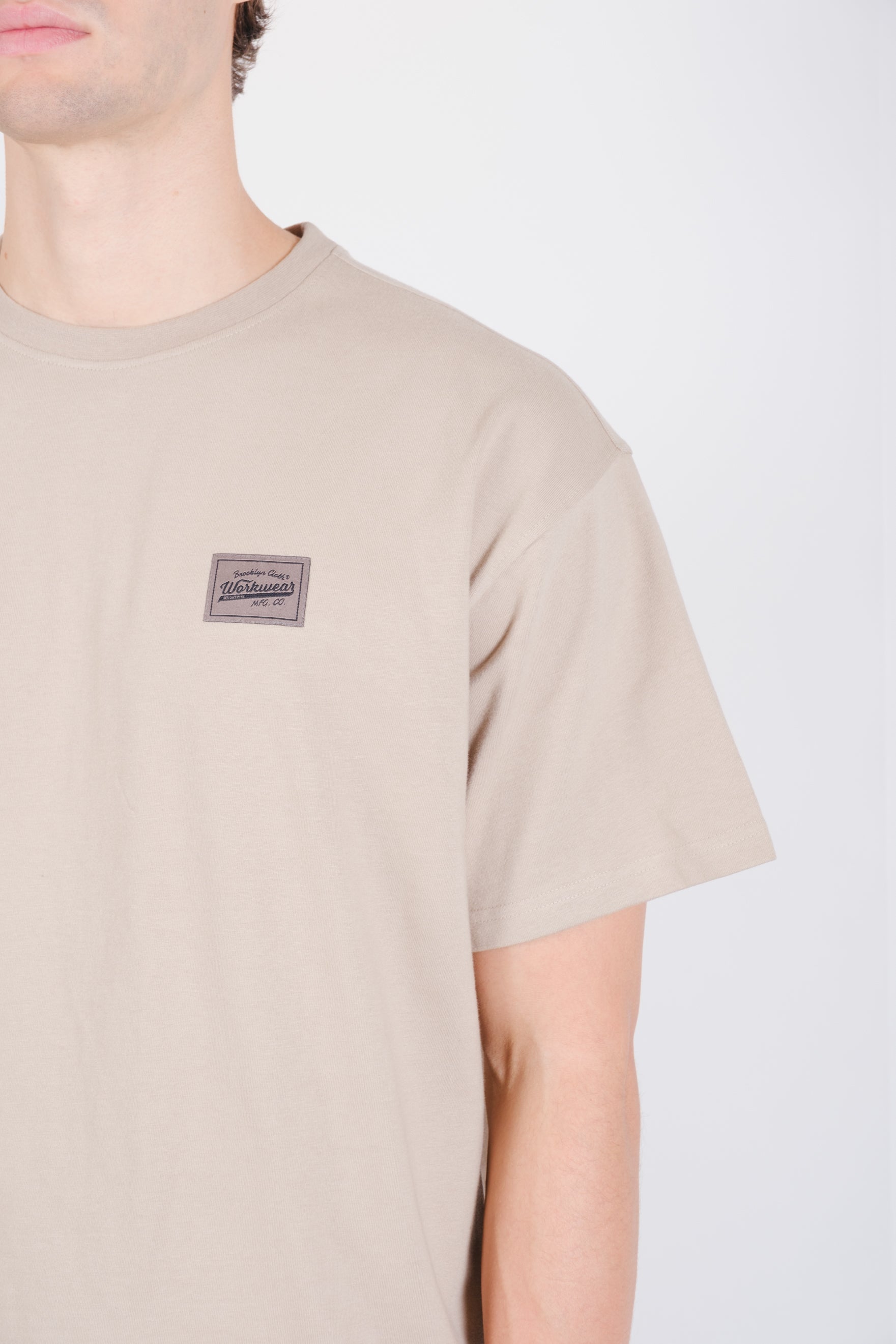 Workwear tee featuring a back graphic 
#color_pumice stone_