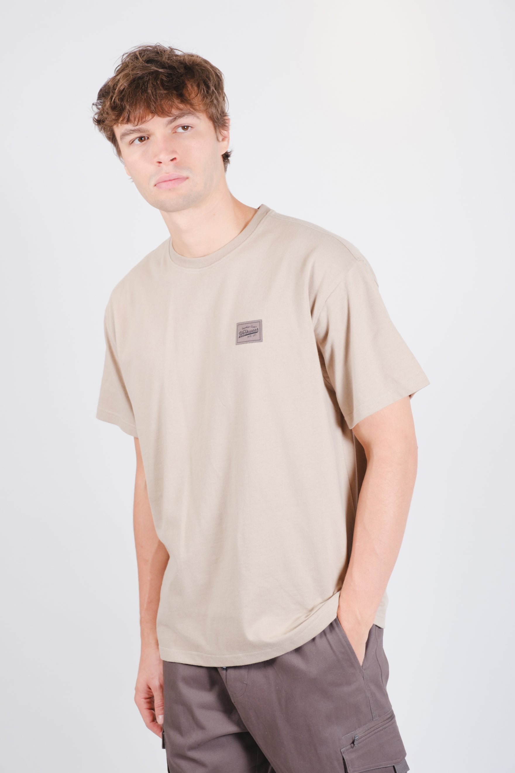 Short-sleeve tee with back compass print, perfect for casual wear
#color_pumice-stone_